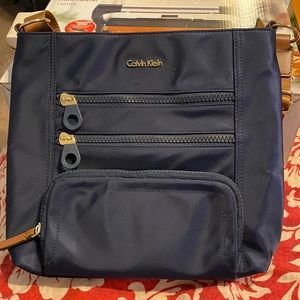 Calvin Klein Navy blue with brown strap purse.  Exc new condition.